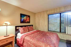 a bedroom with a bed and a window at Discovery 4 119 in Mammoth Lakes +89 photos