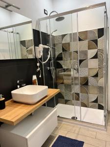 a bathroom with a sink and a shower at L'Affaccio in Amantea