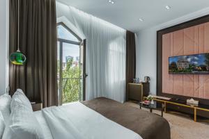 Postel nebo postele na pokoji v ubytování Ivy Garden Hotel Baku