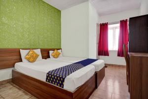 Postel nebo postele na pokoji v ubytování SPOT ON Riyan Suites + 20 fotografií