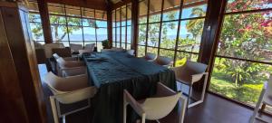 a conference room with a long table and chairs at Casa Santa Rosilla in Lamas