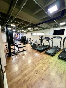 a gym with several treadmills and exercise bikes at Luxor Paulo Miranda in João Pessoa +35 photos