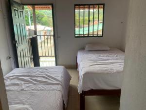 Postel nebo postele na pokoji v ubytování casa xiomy