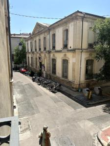 a man walking in front of a building at T2 Au Coeur de Montpellier in Montpellier