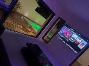 an overhead view of a room with a video game at Villa luxueuse Piscine Chauffée & SPA in Villetelle