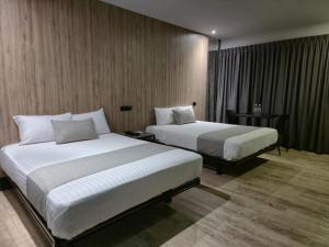 Katil atau katil-katil dalam bilik di Avanta Hotel & Villas Querétaro