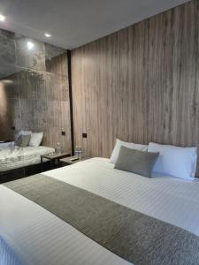 Katil atau katil-katil dalam bilik di Avanta Hotel & Villas Querétaro