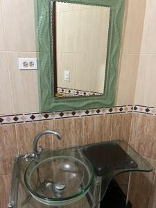 a glass sink in a bathroom with a mirror at Hampton Hill La Loma - Escapada Natural, Santiago RD  +27 photos