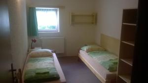 Postel nebo postele na pokoji v ubytování Guest House Honzik
