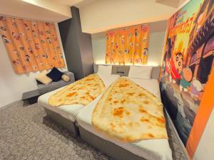 Postel nebo postele na pokoji v ubytování Henn na Hotel Tokyo Hamamatsucho