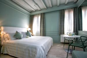 Postel nebo postele na pokoji v ubytování Aquamare, boutique b&b