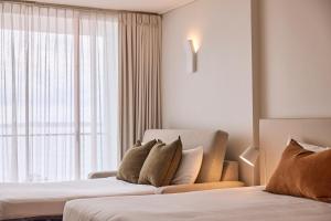 Rydges Cronulla Beachside客房内的一张或多张床位