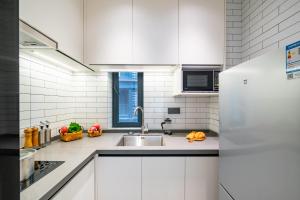 Shenzhen Shatoujiao Subway Station Apartment Hotel廚房或簡易廚房