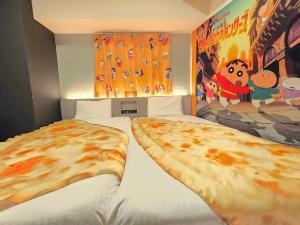 Postel nebo postele na pokoji v ubytování Henn na Hotel Tokyo Hamamatsucho