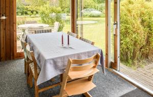 a table with two candles on top of it at Gorgeous Home In Gilleleje With Wifi in Gilleleje
