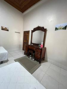 Postel nebo postele na pokoji v ubytování AGA Stay & Kitchen
