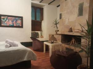 Postel nebo postele na pokoji v ubytování Hotel Pueblo Dorado Sesquilé
