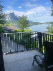 a balcony with a view of a body of water at Mondsee in Au