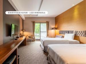 Voodi või voodid majutusasutuse Hualien Toongmao Resort toas