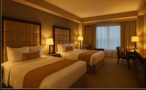 Posteľ alebo postele v izbe v ubytovaní Piccalilli Hotel and suites