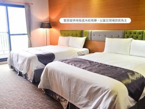 Voodi või voodid majutusasutuse Hualien Toongmao Resort toas