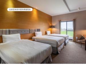 Voodi või voodid majutusasutuse Hualien Toongmao Resort toas