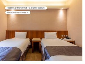 Voodi või voodid majutusasutuse Hualien Toongmao Resort toas