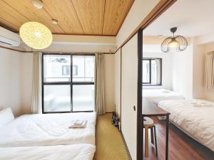 Llit o llits en una habitació de perfect life緑橋