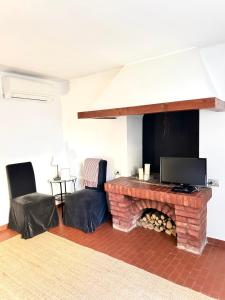 TV a/nebo společenská místnost v ubytování Casa del Vigneto - NEW near VENICE - rooms+bathroom - INDEPENDENT
