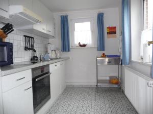 Kuchyň nebo kuchyňský kout v ubytování Haus Heverstrom