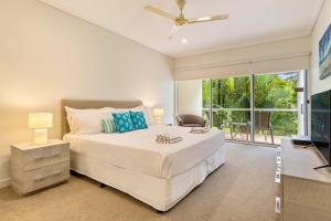 Ένα ή περισσότερα κρεβάτια σε δωμάτιο στο Mirage Resort Villa 446 with access to Sheraton Facilities