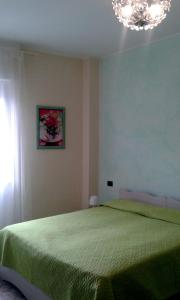 Postel nebo postele na pokoji v ubytování Cristina Apartment