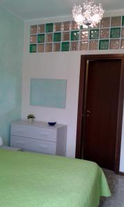 Postel nebo postele na pokoji v ubytování Cristina Apartment