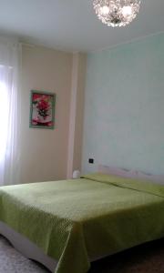Postel nebo postele na pokoji v ubytování Cristina Apartment