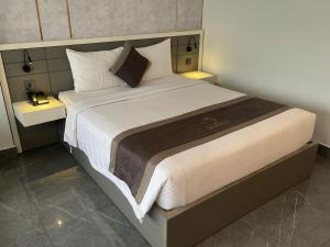 Postel nebo postele na pokoji v ubytování LION 9 HOTEL
