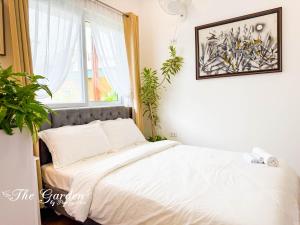 Postel nebo postele na pokoji v ubytování Sky Garden Homestay