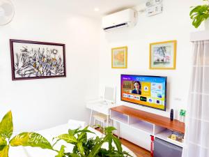 TV a/nebo společenská místnost v ubytování Sky Garden Homestay + 4 fotografie