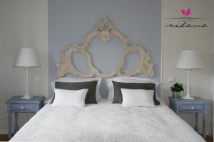 Uma cama ou camas num quarto em Villa Silene