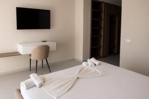Postel nebo postele na pokoji v ubytování Velmar Hotel