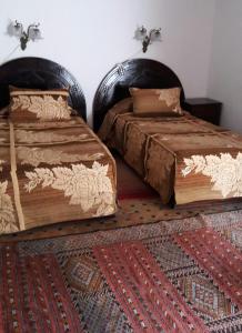 Postel nebo postele na pokoji v ubytování Dar El Mouhit