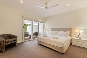 Ένα ή περισσότερα κρεβάτια σε δωμάτιο στο Mirage Resort Villa 434 with access to Sheraton Facilities