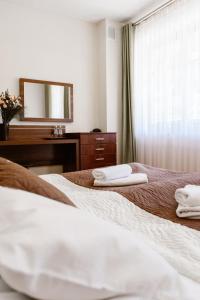 Posteľ alebo postele v izbe v ubytovaní Aparthotel Bellamonte