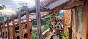 a wooden building with a group of people in it at Wisnu Lumbung Uluwatu in Uluwatu