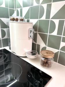 a coffee maker on a shelf in a kitchen at Studio Cosy - Centre-ville in Brest