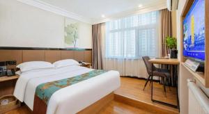 Postel nebo postele na pokoji v ubytování GreenTree Inn Puyang Pushang Huanghe Road