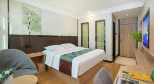 Sjónvarps- og/eða afþreyingartæki á GreenTree Inn Puyang Pushang Huanghe Road