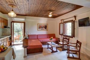 a living room with a couch and a table at Diplomats' Holidays in Chorto