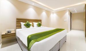 Letto o letti in una camera di Treebo Iffco Chowk