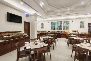 A restaurant or other place to eat at Ramada by Wyndham Beach Hotel Ajman