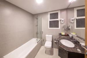 A bathroom at Ramada by Wyndham Beach Hotel Ajman